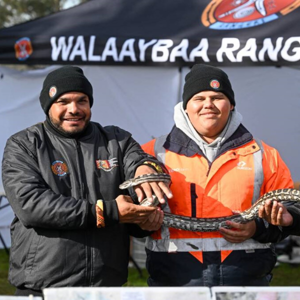Walaaybaa Rangers Bareki Knox, Lachlan Power and Barega Knox at the inaugural Aboriginal Ranger Gathering held on Trelawney Station in June 2025