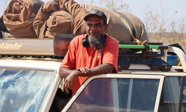 KJ Ranger posed with his work vehicle 